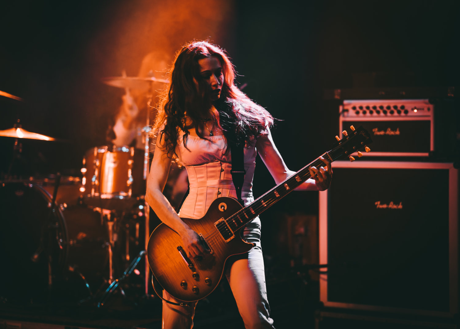 Gretchen Menn playing guitar with Zepparella